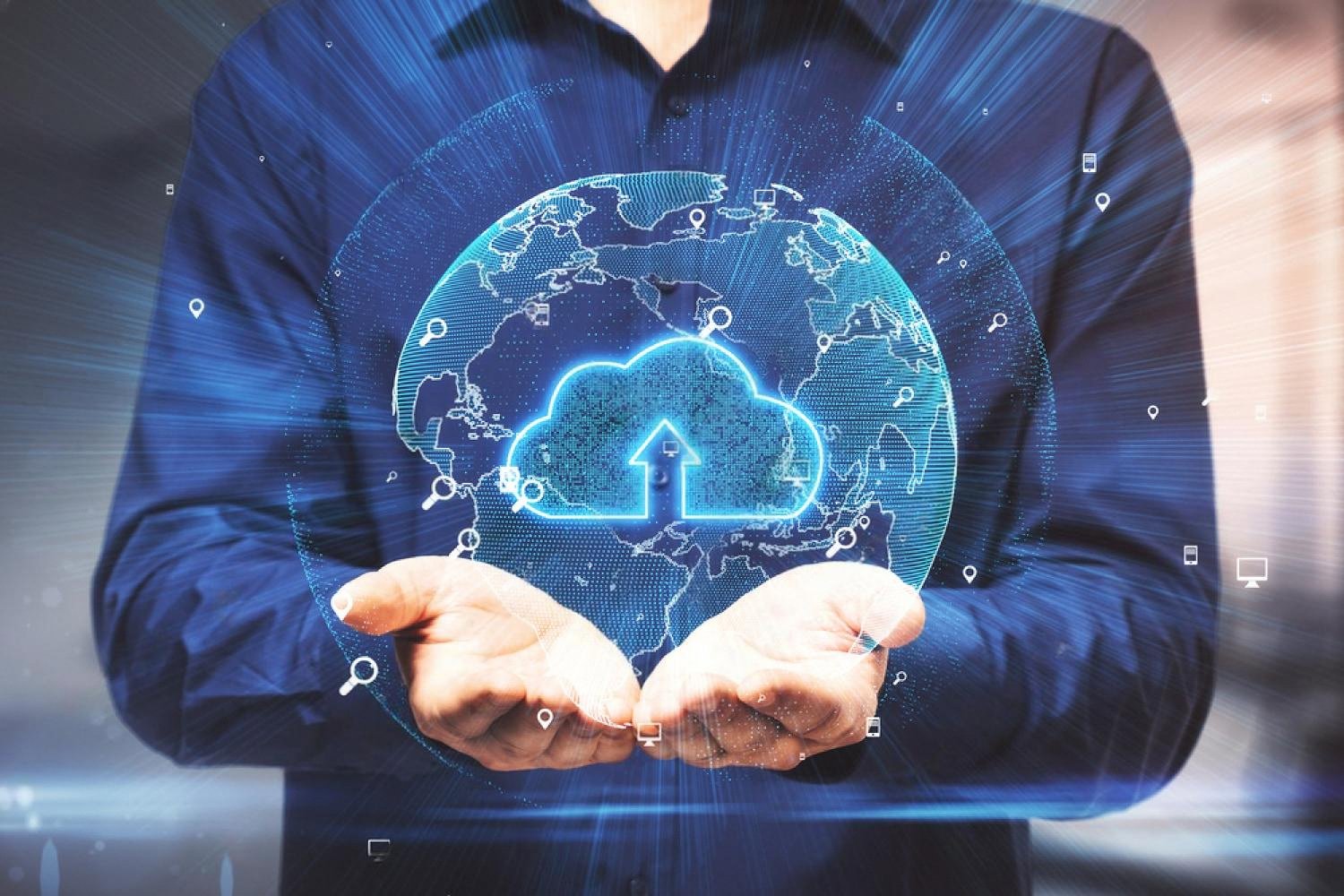 Business professional holding a digital cloud icon representing data backup before an office move in Dubai